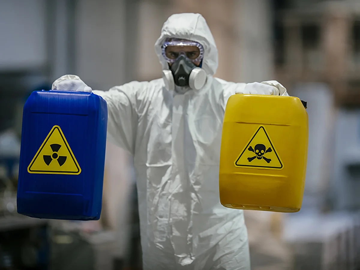 Biohazard cleanup technicians in protective equipment at a remediation scene in Erie, CO